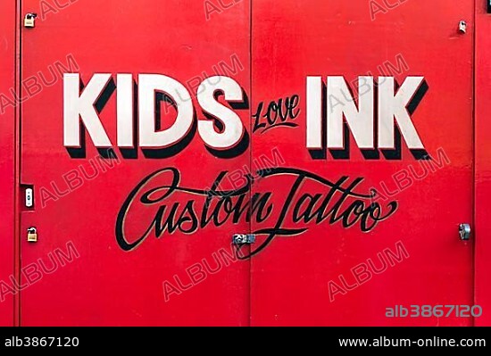 Painted sign for Kids Love Ink tattoo parlor, tattoo studio, Cheshire Street, London, England, United Kingdom, Europe.
