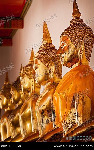Sitting Buddha statues close up. Wat Pho temple, Bangkok, Thailand, Asia.