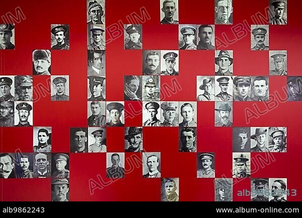 Photo wall showing perished soldiers in visitor centre of the Lijssenthoek Military Cemetery, largest First World War One hospital cemetery in the Ypres Salient, Poperinge, Belgium, Europe.