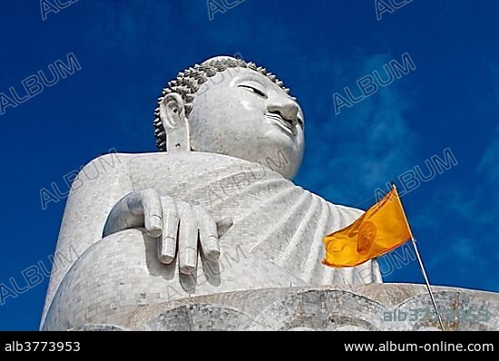 Great Buddha with a yellow Dharmacakra flag, Chalong, Phuket Province, Thailand, Asia.