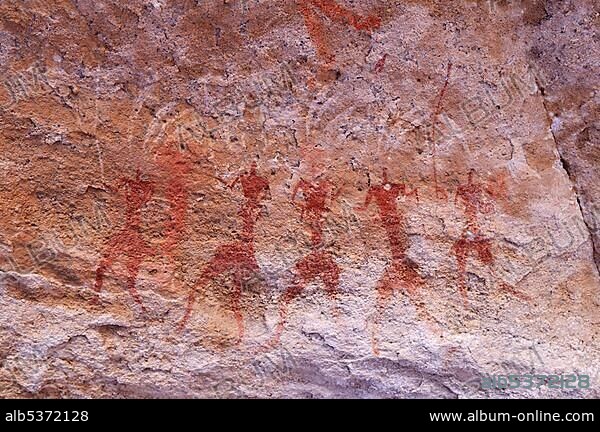 Historic painting of running or dancing people, neolithic rock art of Tassili n'Ajjer National Park, Unesco World Heritage Site, Wilaya Illizi, Algeria, Sahara, North Africa, Africa.