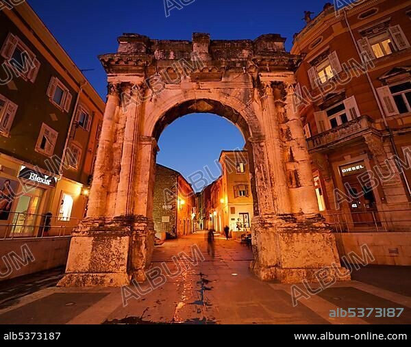 Triumphal Arch of the Sergii at night in Pula, Croatia, Europe.