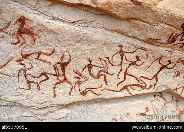 Group of painted warriors or hunters, neolithic rockart at Arakokem, Adrar Tekemberet, Immidir, Algeria, Sahara, North Africa, Africa.