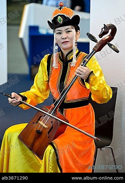 Mongolian musician is playing the horse-head fiddle or Morin Khuur, also Morin Chuur, Mongolia, Asia.