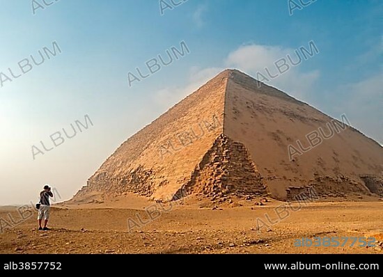 Tourist takes pictures of Sneferu's Bent Pyramid, 2600 BC, Dahshur Necropolis, Dahshur, Egypt, Africa.