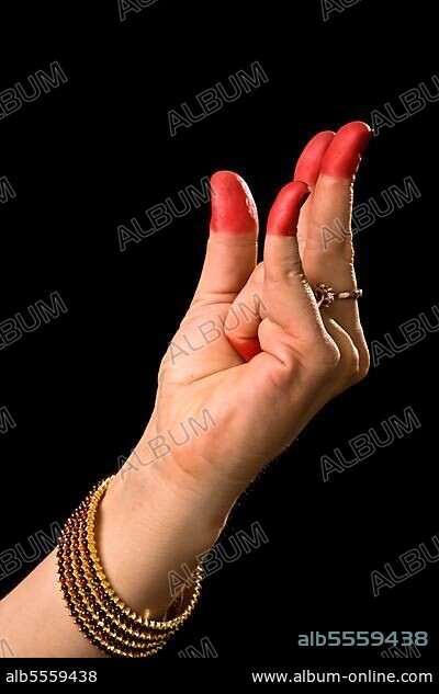 Woman hand showing Kangula hasta (meaning "Tail") of indian classic dance Bharata Natyam.