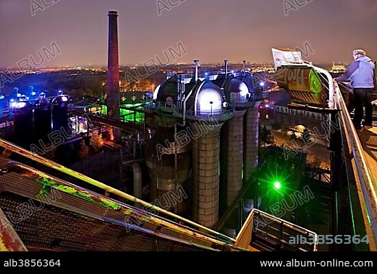 The illuminated Landschaftspark Duisburg-Nord, public park on a former industrial site, from blast furnace No 5, Duisburg, Ruhr Area, North Rhine-Westphalia, Germany, Europe.