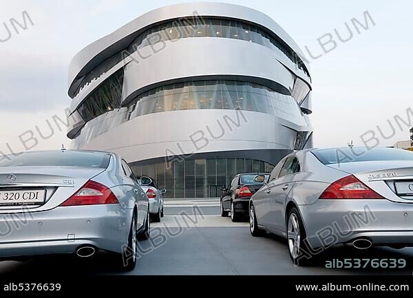 Silver Mercedes CLS parking in front of the Mercedes-Benz-Museum, Stuttgart, Baden-Wuerttemberg.
