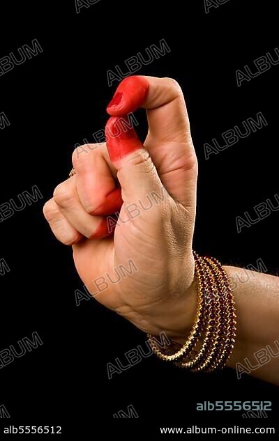 Woman hand showing Kapittha hasta (hand gesture) (also called mudra) (meaning "Godess Lakshmi") of indian classic dance Bharata Natyam. Also used in Indian dances Odissi and Kuchipudi. kapittha Godess Lakshmi.