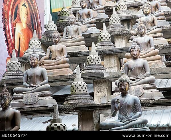 Buddha statues at Gangaramaya Buddhist Temple, Colombo, Sri Lanka, Asia.