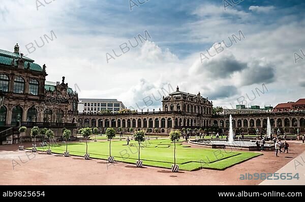View of Zwinger square from steps of Old Masters Picture Gallery; Dresden; Saxony; Germany. Great clouds in blue sky; famous picture gallery with world-scale masterpieces; heavily ruined in WWII and then restored.