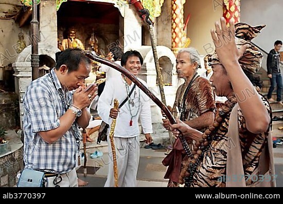 Animist hermit say healing prayers and tell fortunes at Doi Suthp Buddhist temple in Chiang Mai, Thailand, Asia.
