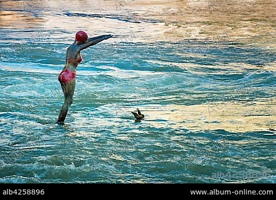 Woman Statue diving in the Vardar river, Skopje, Macedonia, Europe.