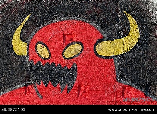 Red monster with yellow horns, fantasy figure, graffiti, street art, Duisburg, North Rhine-Westphalia, Germany, Europe.