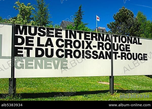 At the entrance to the International Red Cross and Red Crescent Museum in Geneva, headquarters of the International Committee of the Red Cross, ICRC, with the Red Cross flag in the back, Geneva, Switzerland, Europe.