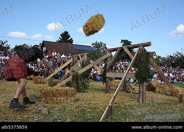 Discipline sheaf toss over an obstacle, Highland Games in Kreenheinstetten, Sigmaringen district, Upper Swabia, Baden-Wuerttemberg, Germany, Europe.