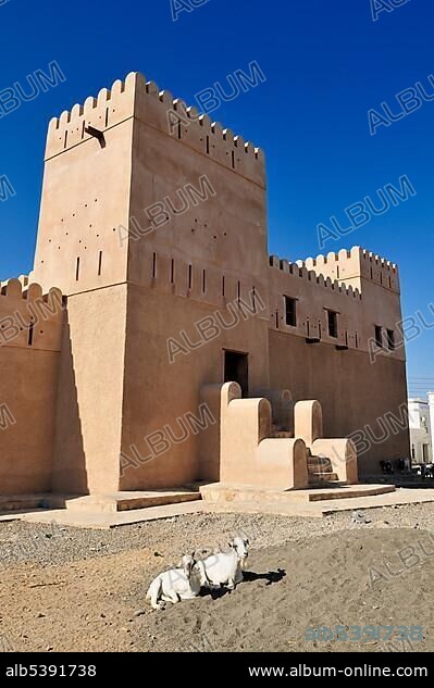 Historic adobe fortification, watchtower of Al Ayjah Castle or Fort in Sur, Al Sharqiya Region, Sultanate of Oman, Arabia, Middle East.