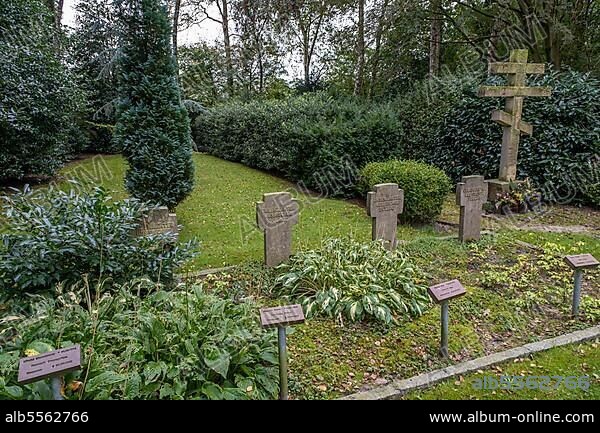Gravestones for unknown Russian soldiers and orthodox Russian cross at the cemetery for Soviet prisoners of war from WW2, war cemetery Tannenhausen, Aurich, Lower Saxony, Germany, Europe.