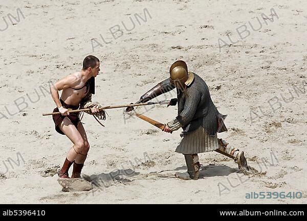 Retiarius versus Scissor, a gladiator fight, exhibition fight, Familia Gladiatoria Pulli Cornicinis by Marcus Junkelmann, Roemerfest festival 2012, stadium of the Archaeologischer Park Xanten outdoor museum, Lower Rhine region, North Rhine-Westphalia, Germany, Europe.