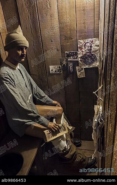 Diorama of British soldier sitting in dugout toilet of First World War One trench in the Memorial Museum Passchendaele 1917 at Zonnebeke, Belgium, Europe.