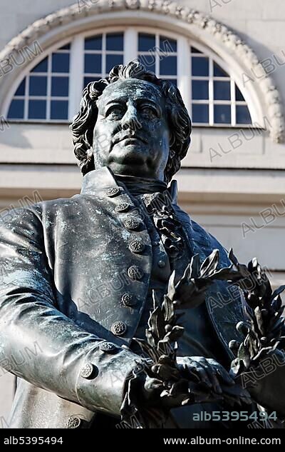 Goethe statue, Goethe and Schiller monument in front of the Deutsches Nationaltheater theatre in Weimar, Thuringia, Germany, Europe.
