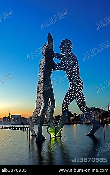 Molecule Men, 30 metre high artwork made of aluminium, sculpted by Jonathan Borofsky, standing in the Spree River, at sunset, Berlin, Germany, Europe, PublicGround, Europe.