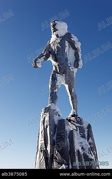 Wood sculpture, Sky Trooper, by Mario Gasser at the summit of Zugspitze Mountain, Wetterstein Mountains, Tyrol, Austria, Europe.