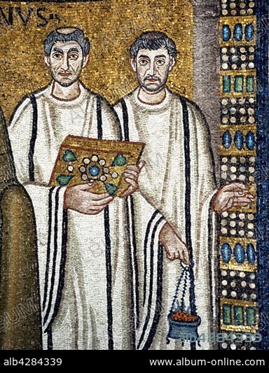 Basilica San Vitale in Ravenna (Italy). Mosaic of the left part of the apse: the cortege of Emperor Justinian. Detail: a deacon carrying the gospels, and a subdeacon with a censer. 6th century.. Its construction was begun by Bishop Ecclesius in 527, and completed in 548 by the twenty-seventh Bishop of Ravenna, Maximianus.