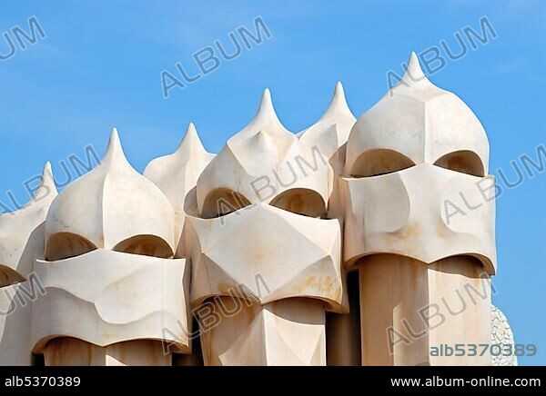 Warrior-like chimneys on the roof terrace of Casa MilÃ¡, La Pedrera, residential building by Catalan architect Antoni Gaudi on the Passeig de Gracia, Eixample District, Barcelona, Catalonia, Spain, Europe.