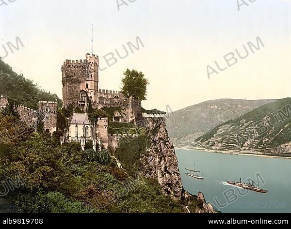 Burg Rheinstein; also called Burg Voitsberg or Vaitzburg; is a Spornburg in the upper Middle Rhine Valley in the municipality of Trechtingshausen in the district of Mainz-Bingen in Rhineland-Palatinate; Germany; c. 1900; Historic; digitally restored reproduction of a photochrome print from the period; Europe.