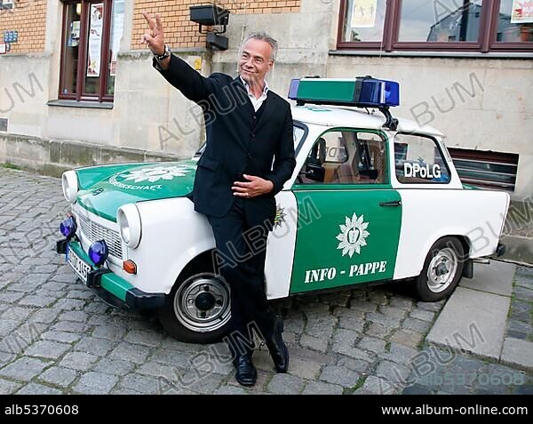 Klaus J. Behrendt, actor, "Tatort", German TV crime series, in front of a police Trabant car.