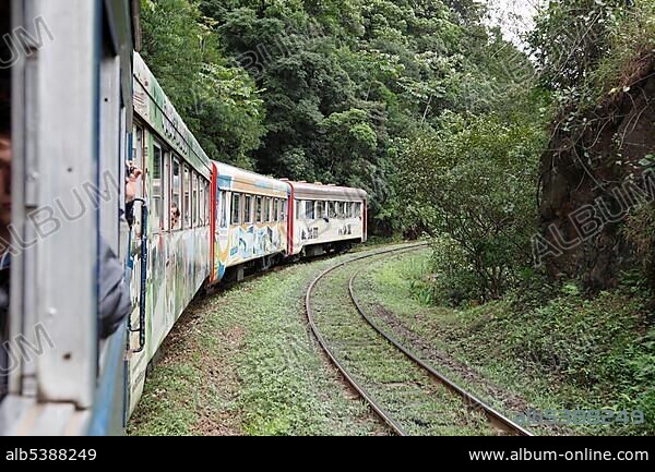 Train on the historic railway line between Curitiba and ParanaguÃ¡, which crosses the mountain range along the southern Brazilian coast, Serra do Mar, Parana, Brazil, South America.