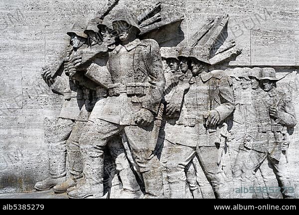Marching soldiers, relief from Muschelkalk, shell limestone, 39er Denkmal, memorial, war memorial in the Nazi style, Duesseldorf-Golzheim, North Rhine-Westphalia, Germany, Europe.