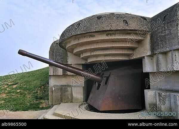 German gun in bunker of WW2 Batterie Le Chaos, part of Second World War Two Atlantikwall at Longues-sur-Mer, Normandy, France, Europe.