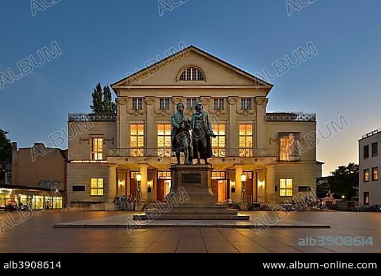 Enlightened German National Theatre with Goethe Schiller monument, dusk, Weimar, Thuringia, Germany, Europe.
