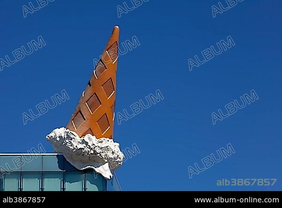 "Dropped Cone" by the pop-art artist Claes Oldenburg, ice cone sculpture on the roof of the Neumarkt Galerie, Cologne, North Rhine-Westphalia, Germany, Europe.