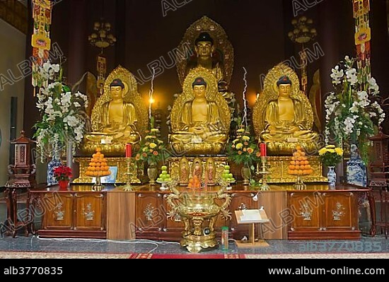 Buddha statues with an altar in Linh Thuu Pagoda, Spandau, Berlin, Germany, Europe.
