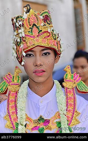 Magnificently dressed aspiring novice at Novice Monk Celebration, Yangon, Myanmar, Asia.