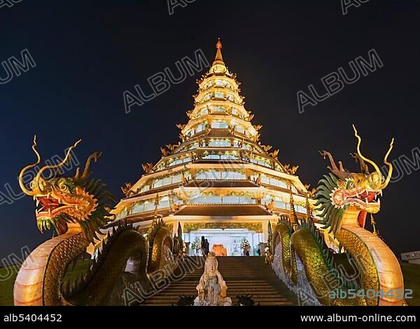 Nine-storey Chinese pagoda at dusk, dragons at the entrance to Wat Huay Pla Kang Temple, Kuan Yin, Chiang Rai, Northern Thailand, Thailand, Asia.