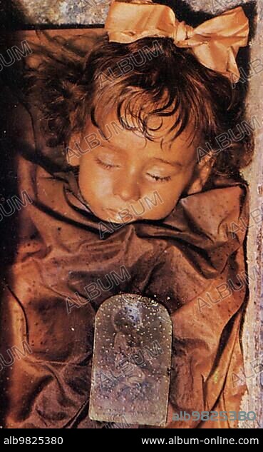 The Capuchin Crypt of Palermo; Le Catacombe dei Cappuccini; extensive crypt complex under the Capuchin monastery in Palermo and; with its natural mummies; one of the most famous burial sites in the world; public domain Photo of the mummy of Rosalia Lombardo; 1820; Italy; Historic; digitally restored reproduction from a 19th-century master copy; Europe.