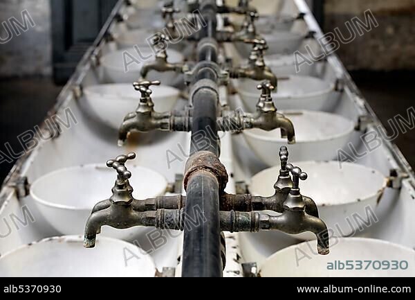Old faucets, former washroom for workers, Hendrichs swage forge, LVR Industrial Museum, Solingen, North Rhine-Westphalia, Germany, Europe.