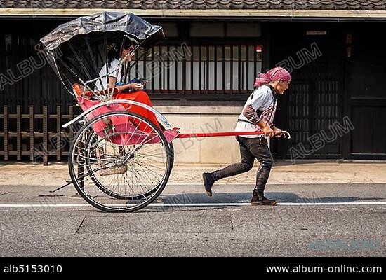 Rickshaw with a passenger, Arashiyama, Kyoto, Japan, Asia.