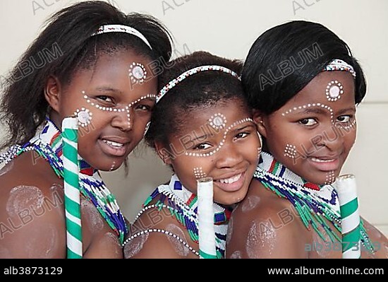 Portrait of three Xhosa girls with traditional adornment, Grahamstown, Eastern Cape, South Africa, Africa.