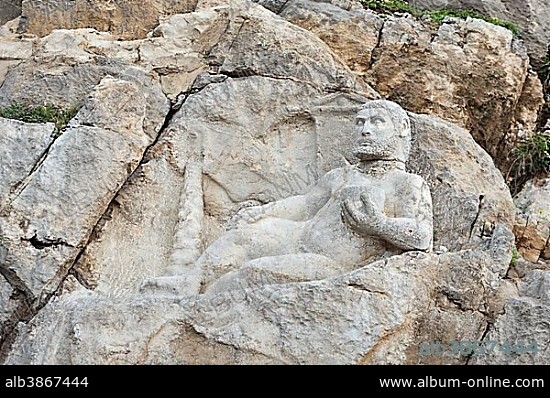 Ancient relief of the Seleucids, lying Herakles with cup, Hercules, Bisutun, Kermanshah Province, Iran, Asia.