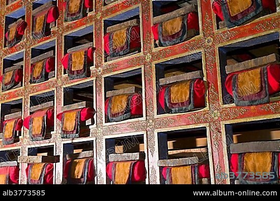 Colorful shelf with tibetean prayerbooks, Taksindu, Solukhumbu District, SagarmÄthÄ Zone, Nepal, Asia.