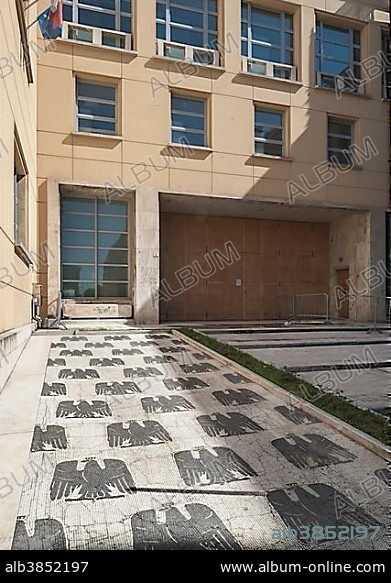 Entrance to a school with a marble mosaic, eagle wearing a crown, Italian fascist symbolism, Piazzale della Vittoria, Forlì, Emilia-Romagna, Italy, Europe.