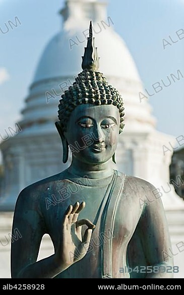 Buddha Statue, Jnana Mudra or Gyan Mudra, white Dagoba in the back, Seema Malaka Temple, Beira Lake, Beira Lake, Colombo, Sri Lanka, Asia.