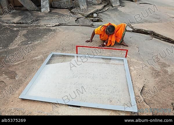 Rock inscriptions behind glass, Jain temple on Vindhyagiri Hill at Shravanabelagola, Karnataka, South India, India, South Asia, Asia.