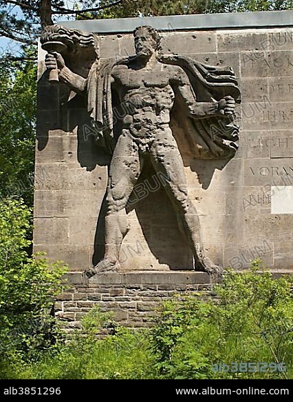 Sculpture torchbearer, representation of the Aryan master race Herrenmensch, Ordensburg Vogelsang, educational centre of the NSDAP from 1936-1939, now Forum Vogelsang, Eifel, North Rhine-Westphalia, Germany, Europe.