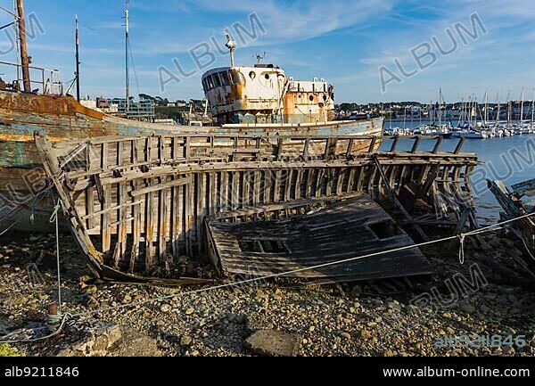 France - 22 August 2019: horizontal view of old fishing boat wrecks in the ship cemetery of Camaret-Sur-Mer.